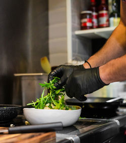 Midsection of man preparing food at home