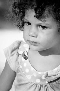 Close-up of cute girl with curly hair