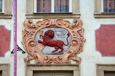 Low angle view of ornate window on building