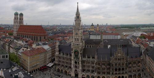 High angle view of city buildings against cloudy sky from munich