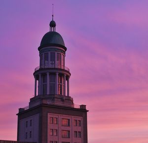 Low angle view of building against cloudy sky