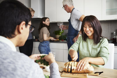 Family preparing meal in kitchen