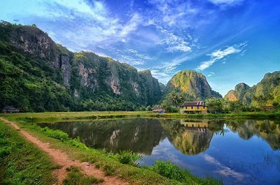 Calm lake with mountains in background