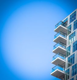 Low angle view of building against clear blue sky