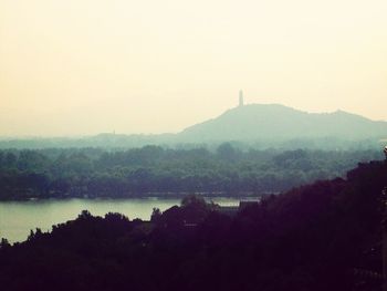 Scenic view of mountains in foggy weather