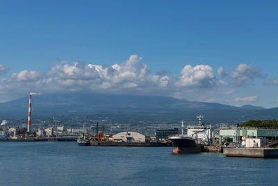 Mount fuji near industrial area, factory, japanese port and harbor in fuji city, shizuoka, japan. 