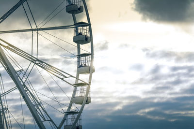 Low angle view of ferris wheel against sky