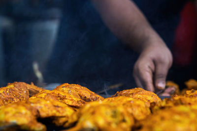 Midsection of man preparing food