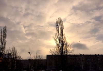 Low angle view of building against cloudy sky