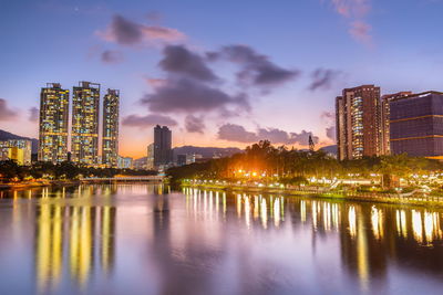 Illuminated buildings reflection on water