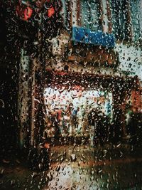 Full frame shot of wet car window in rainy season