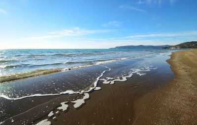 Scenic view of beach against sky