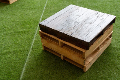 High angle view of wooden post on field