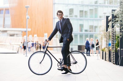 Man riding bicycle in city