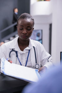 Portrait of young man working at clinic