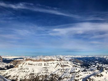 Aerial view of snowcapped mountains against sky