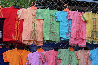 Clothes drying on clothesline at market stall