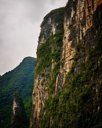 Low angle view of rock formations against sky