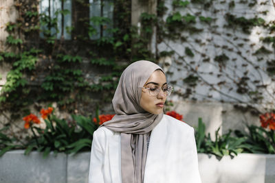 Woman wearing headscarf while standing outdoors
