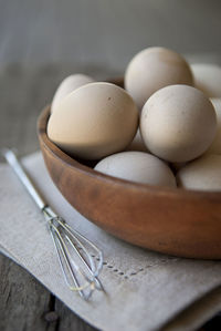 Close-up of eggs in container on table