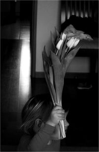 Close-up portrait of woman holding umbrella