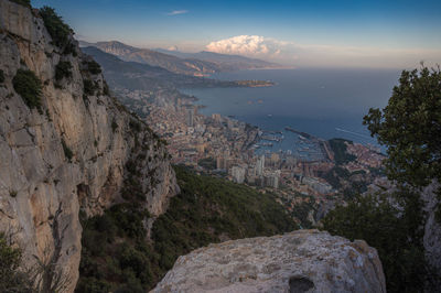 Scenic view of buildings and mountains against sky