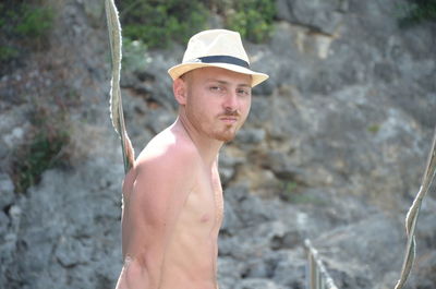 Portrait of young man standing outdoors