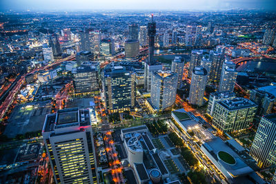 High angle view of illuminated buildings in city