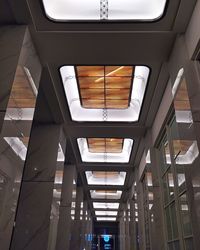 Low angle view of illuminated skylight in building