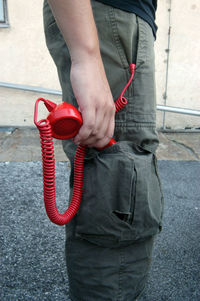 Man with a telephone receiver, talking to a customer or client