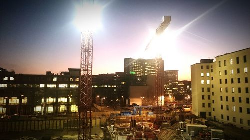 Buildings in city at sunset