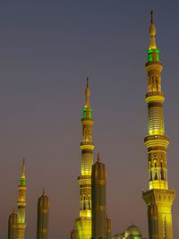 View of buildings in city against clear sky