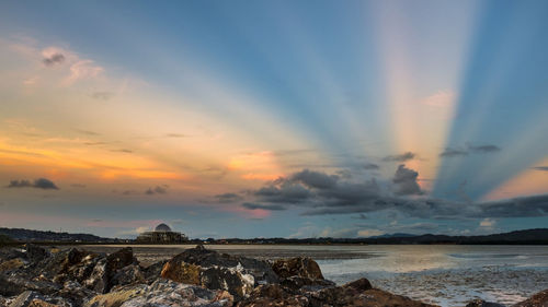 Scenic view of sea against sky at sunset