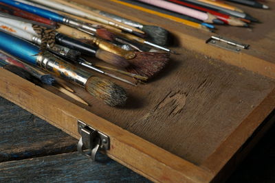 High angle view of paintbrushes on table