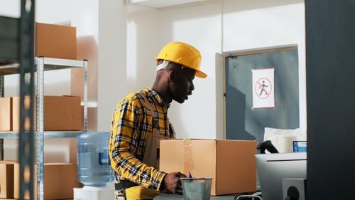 Rear view of man working at construction site