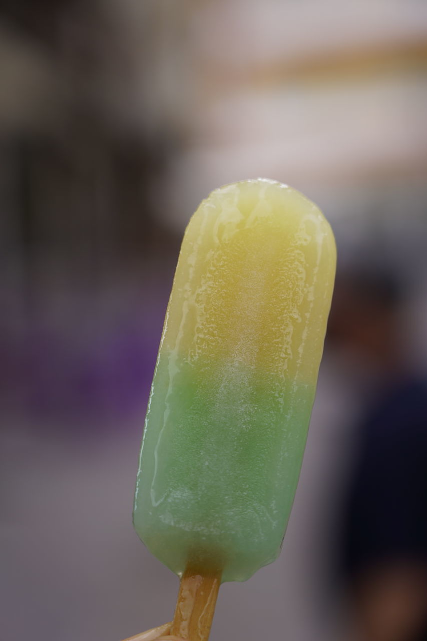 CLOSE-UP OF ICE CREAM CONE OUTDOORS