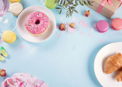 Directly above shot of christmas cookies on yellow background