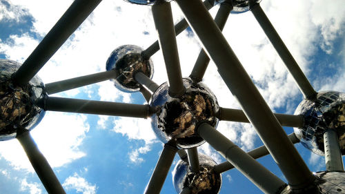 Low angle view of bicycle wheel against sky