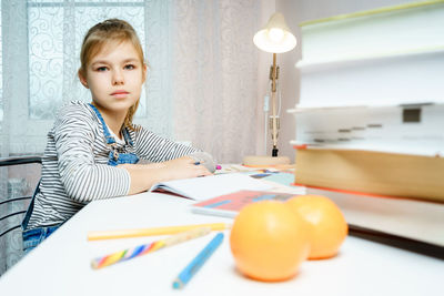 Portrait of girl studying at home