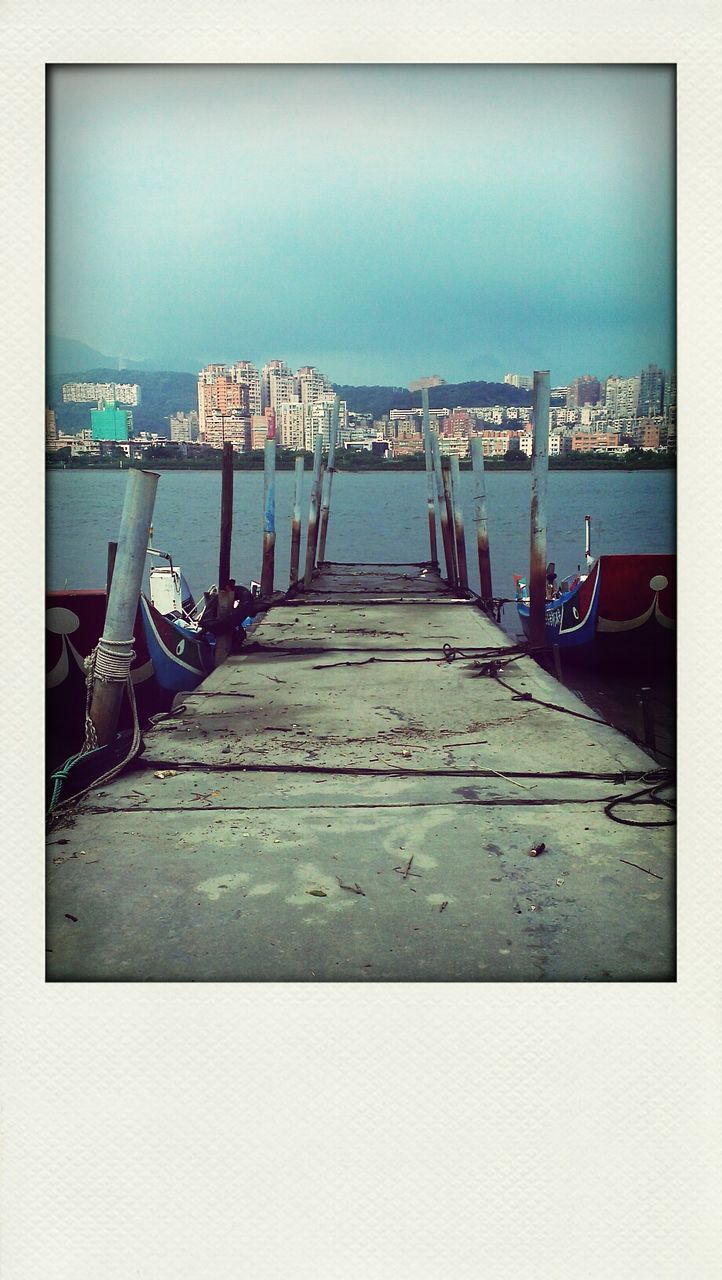 transfer print, auto post production filter, built structure, architecture, water, building exterior, sky, transportation, sea, pier, nautical vessel, blue, day, outdoors, the way forward, moored, city, bridge - man made structure, mode of transport, boat