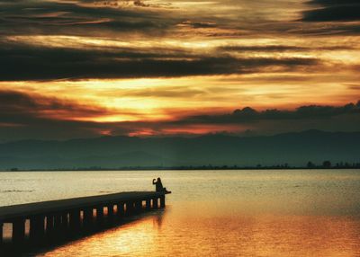 Silhouette of people at sunset