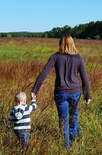 Girl standing on grassy field