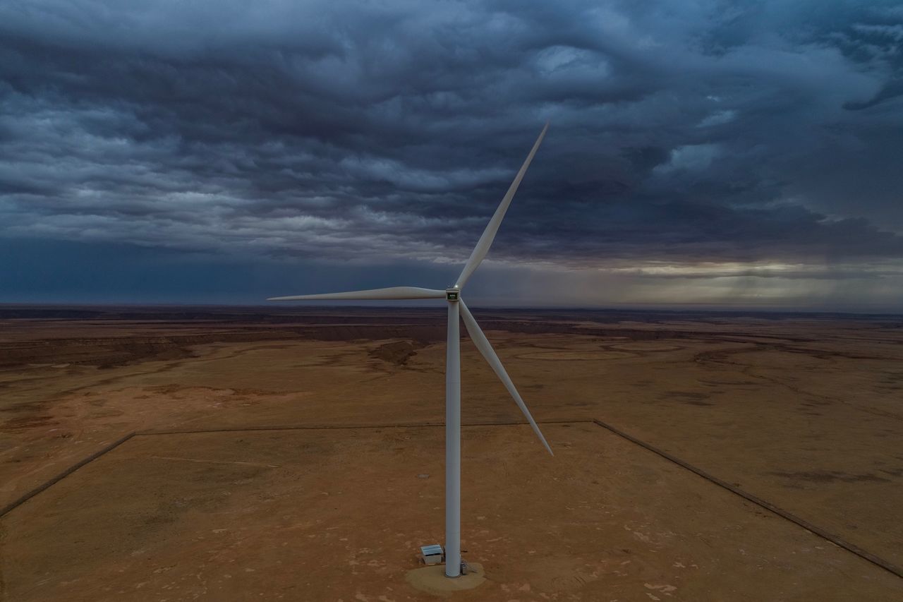 WINDMILL ON LAND AGAINST SKY