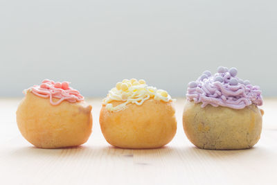 Close-up of cupcakes against white background