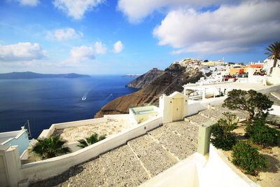 High angle view of sea and buildings against sky