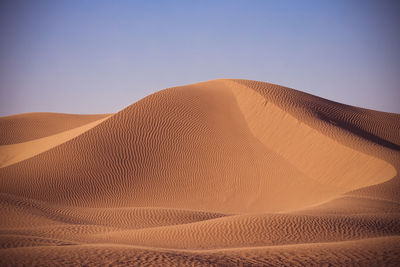 Scenic view of desert against clear sky