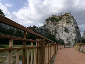 Low angle view of footbridge against sky