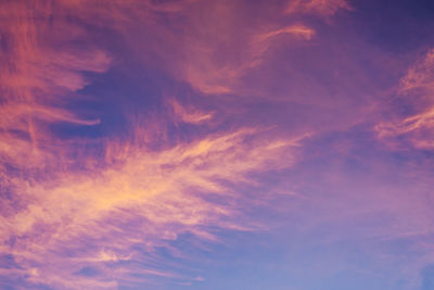 Low angle view of dramatic sky during sunset