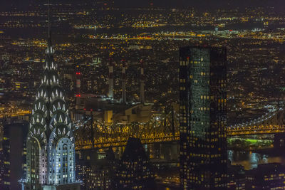 Illuminated modern buildings in city at night