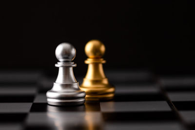 Close-up of chess pieces against blurred background